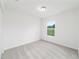 Bright, carpeted bedroom featuring a window for natural light at 14893 Sw 23Rd Pl, Ocala, FL 34481