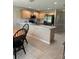 Spacious kitchen features updated stainless appliances, countertop seating and ample cabinet space at 16023 Sw 14Th Avenue Rd, Ocala, FL 34473
