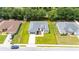 Aerial view of home showing property line, green lawn, landscaping, and proximity to neighbors at 162 Nw 42Nd Pl, Ocala, FL 34475
