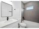 Modern bathroom featuring sleek gray tile and black hardware at 162 Nw 42Nd Pl, Ocala, FL 34475