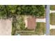 Aerial view of a home with a driveway and surrounding trees at 16605 Sw 31 Cir, Ocala, FL 34473