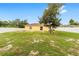 Expansive backyard with lush greenery, enclosed by a white fence, offering privacy and space for outdoor activities at 16605 Sw 31 Cir, Ocala, FL 34473