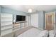 A bedroom features a large television, storage and a closet at 16605 Sw 31 Cir, Ocala, FL 34473