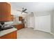 Well-lit kitchen featuring stainless steel appliances, wooden cabinets, tile floors, and ample storage at 16605 Sw 31 Cir, Ocala, FL 34473