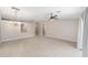 The open living room features tile floors and neutral paint providing a bright space at 16605 Sw 31 Cir, Ocala, FL 34473
