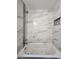 Modern bathtub and shower features marble-look tiling with shower niche at 20 Malauka Trail Crse, Ocklawaha, FL 32179