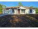 Charming single-story home featuring new construction, a brown roof, and a one-car garage at 20 Malauka Trail Crse, Ocklawaha, FL 32179