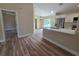Open kitchen area with stainless steel appliances and white cabinets at 20 Malauka Trail Crse, Ocklawaha, FL 32179