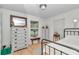 Neutral bedroom with two dressers, natural light from two windows, wood floors and metal frame bed at 23608 Ne 124 Place Rd, Salt Springs, FL 32134