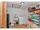 Spacious laundry room with washer, dryer, utility sink, and ample storage shelving at 23608 Ne 124 Place Rd, Salt Springs, FL 32134