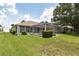 Landscaped backyard with well-maintained lawn and an enclosed pool area for outdoor enjoyment and relaxation at 2478 Nw 50Th Ave, Ocala, FL 34482