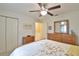 Comfortable bedroom featuring a ceiling fan, neutral wall color and wood furniture at 2478 Nw 50Th Ave, Ocala, FL 34482