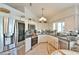 Modern kitchen featuring stainless steel appliances, granite countertops, and ample cabinet space at 2478 Nw 50Th Ave, Ocala, FL 34482