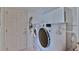 Functional laundry room with washer, dryer, and storage cabinets providing convenience and organization at 2478 Nw 50Th Ave, Ocala, FL 34482