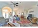 Inviting living room boasts vaulted ceilings, wood-look tile flooring, and a seamless flow into other living spaces at 2478 Nw 50Th Ave, Ocala, FL 34482
