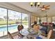 Relaxing covered patio with a chess table, a view of the pool, and outdoor seating at 2478 Nw 50Th Ave, Ocala, FL 34482