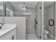 Bathroom featuring walk-in shower with glass doors and modern tile at 3696 Se 139Th Ln, Summerfield, FL 34491