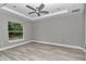 Bedroom with tray ceiling, fan, recessed lighting and natural light from the window at 3696 Se 139Th Ln, Summerfield, FL 34491