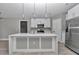 Beautiful kitchen with an island, stainless steel appliances and light colored cabinets at 3696 Se 139Th Ln, Summerfield, FL 34491