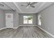 Open-concept living room boasts recessed lighting, a ceiling fan, and views of the surrounding neighborhood at 3696 Se 139Th Ln, Summerfield, FL 34491