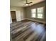 Bedroom with ceiling fan, ample light and new flooring at 4609 Ne 7Th St, Ocala, FL 34470