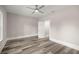 Bright bedroom featuring wood floors and a ceiling fan for added comfort at 4609 Ne 7Th St, Ocala, FL 34470