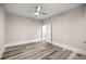 Neutral bedroom with ceiling fan, wood floors and closet access for ample storage at 4609 Ne 7Th St, Ocala, FL 34470