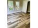 Bedroom with large windows, hardwood floors, closet with door at 4609 Ne 7Th St, Ocala, FL 34470