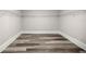 Walk-in closet with wood floors and shelving at 4609 Ne 7Th St, Ocala, FL 34470