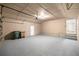 Spacious garage with epoxy flooring, utility door, and two-car capacity at 4609 Ne 7Th St, Ocala, FL 34470