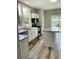 Modern kitchen with granite countertops, stainless appliances, and center island at 4609 Ne 7Th St, Ocala, FL 34470