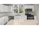 Modern kitchen with stainless steel appliances, granite countertops, and ample natural light at 4609 Ne 7Th St, Ocala, FL 34470