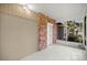 Inviting screened porch featuring brick accents, tiled floor, and ample natural light at 4609 Ne 7Th St, Ocala, FL 34470
