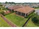 Aerial view of a home's backyard featuring a lanai, with well-maintained landscaping at 5587 Nw 40Th Pl, Ocala, FL 34482