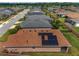 Aerial view of the home's solar panels situated on top of the brown-tiled roof at 5587 Nw 40Th Pl, Ocala, FL 34482
