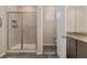 Bathroom features glass shower, granite vanity, and a separate toilet room at 5587 Nw 40Th Pl, Ocala, FL 34482