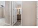 Bathroom entrance view featuring granite-topped vanity and gray wood-look tile at 5587 Nw 40Th Pl, Ocala, FL 34482