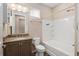 Bathroom featuring modern vanity, combo shower and bathtub with white tile at 5587 Nw 40Th Pl, Ocala, FL 34482