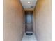 Elegant brown front door with modern hardware and a welcoming entrance mat at 5587 Nw 40Th Pl, Ocala, FL 34482