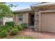 Inviting front entrance with a stone facade and a warm, neutral color palette at 5587 Nw 40Th Pl, Ocala, FL 34482