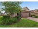 Charming single-Gathering home boasting a brick driveway and a two-car garage at 5587 Nw 40Th Pl, Ocala, FL 34482