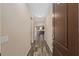 Inviting hallway with neutral walls and stylish flooring leading to an open-concept living space at 5587 Nw 40Th Pl, Ocala, FL 34482