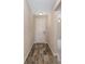 Welcoming hallway with attractive wood-look tile flooring that leads into the home's living area at 5587 Nw 40Th Pl, Ocala, FL 34482