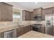 Bright kitchen featuring stainless steel appliances, granite countertops, and ample storage space at 5587 Nw 40Th Pl, Ocala, FL 34482