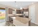 Well-lit kitchen features stainless steel appliances, granite countertops, and a large island with pendant lighting at 5587 Nw 40Th Pl, Ocala, FL 34482