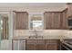 This kitchen features granite countertops, stainless steel appliances, and a convenient breakfast bar at 5587 Nw 40Th Pl, Ocala, FL 34482
