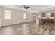 Bright living area with contemporary finishes, tile floors, and an open layout connecting to the kitchen at 5587 Nw 40Th Pl, Ocala, FL 34482