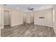 Open-concept living room with tile flooring and neutral paint, flowing into other areas of the home at 5587 Nw 40Th Pl, Ocala, FL 34482