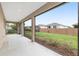 Bright screened-in patio with wide views of the manicured backyard at 5587 Nw 40Th Pl, Ocala, FL 34482