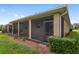 Exterior view of a screened patio with access door to backyard at 5587 Nw 40Th Pl, Ocala, FL 34482